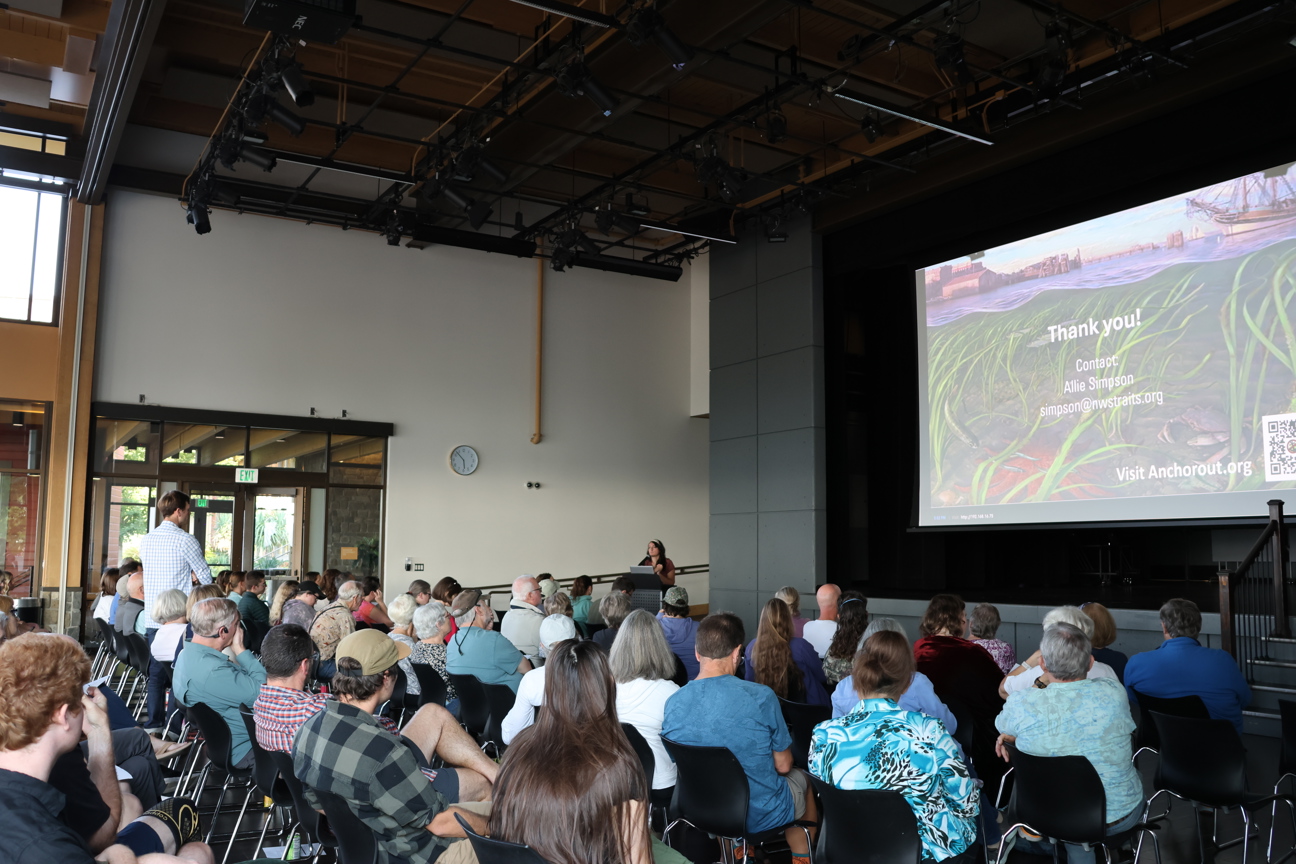 People listening to a presentation about eelgrass.