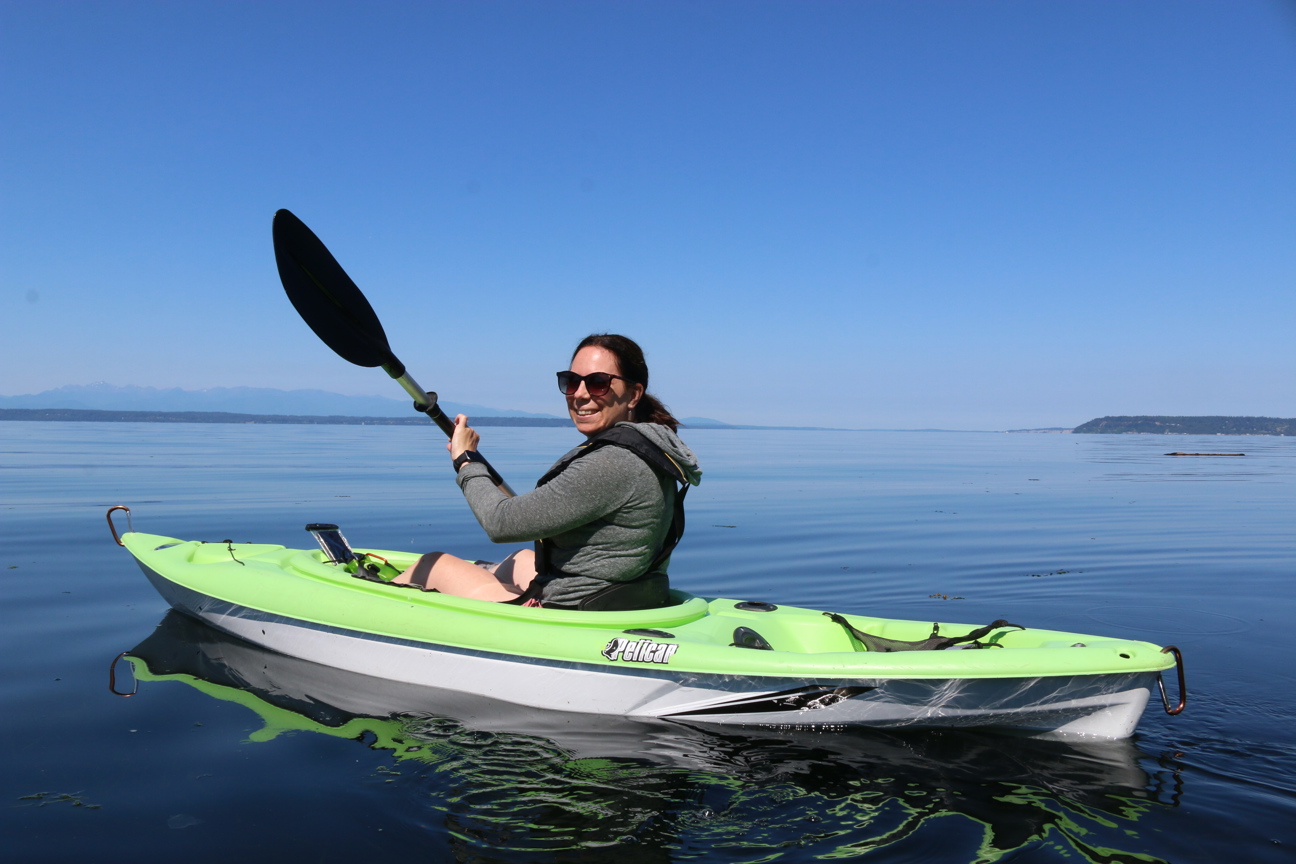 MRC member smiling on a kayak.